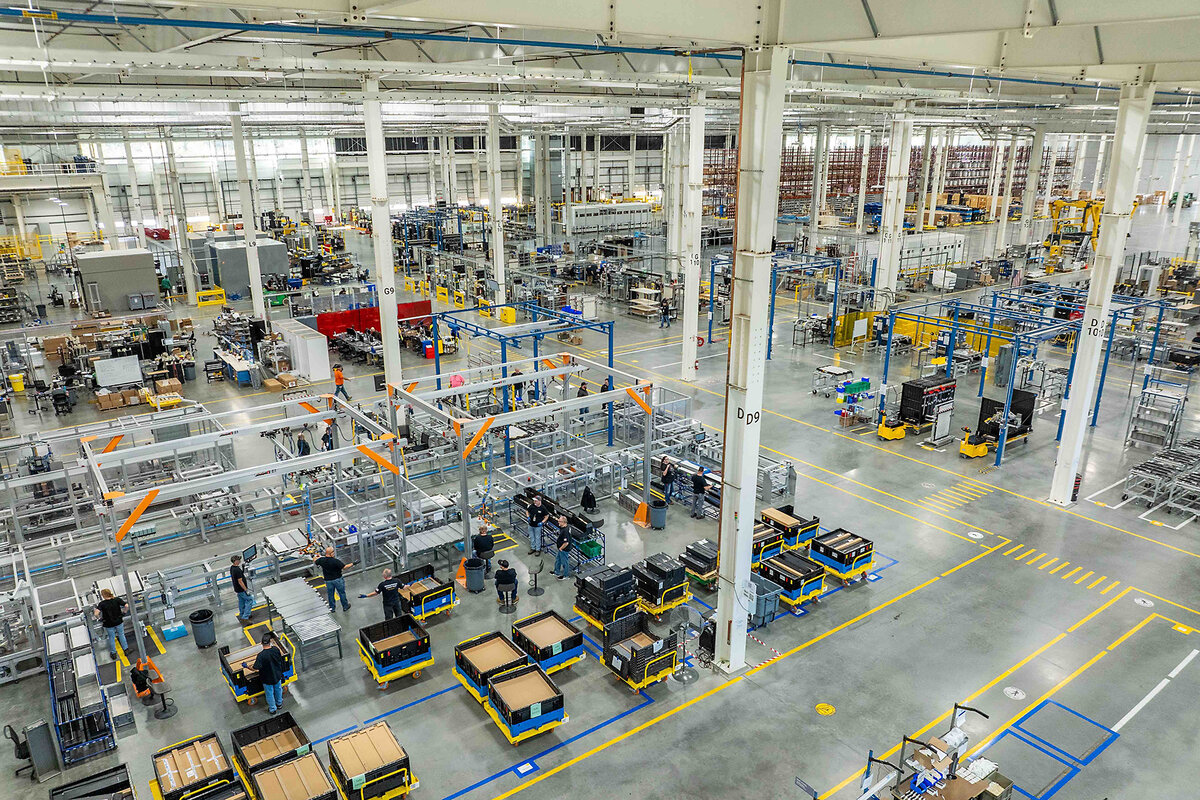 A view of Form Energy's factory floor shows battery equipment, supplies, and lanes for maneuvering.